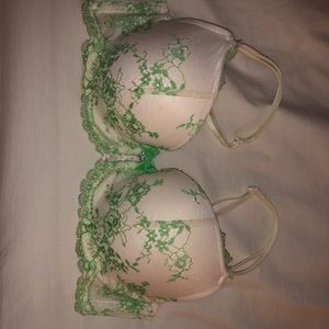 White push up bra with green lace detailed.